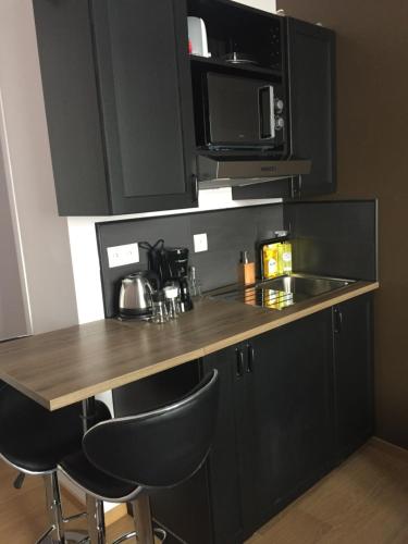Dapur atau dapur kecil di Appart'hôtel et chambres Lens