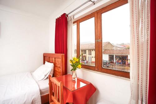 Postel nebo postele na pokoji v ubytování Hostal Danna Inn