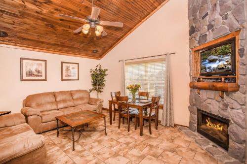 a living room with a couch and a fireplace at The Lodges of the Great Smoky Mountains in Pigeon Forge