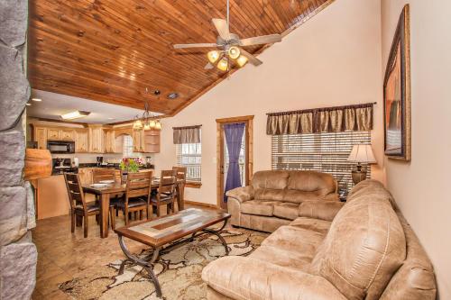 a living room with a couch and a table at The Lodges of the Great Smoky Mountains in Pigeon Forge