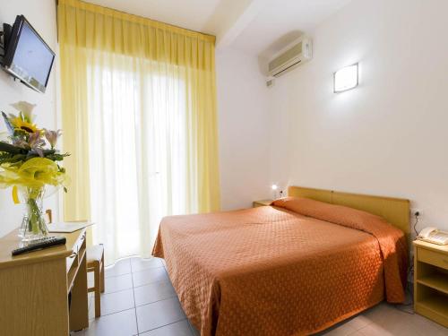 Postel nebo postele na pokoji v ubytování Hotel Meris