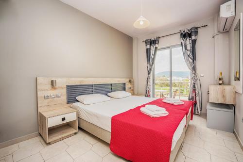 מיטה או מיטות בחדר ב-Maritina Apartments
