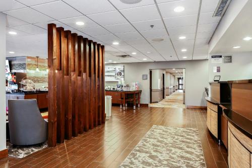 an office lobby with a wooden partition and a desk at Best Western Plus Bellingham in Bellingham