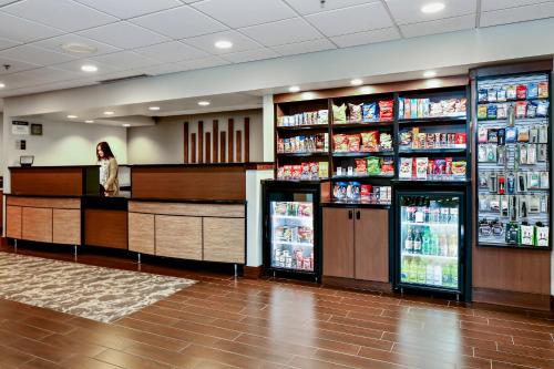 a woman standing at the counter of a store at Best Western Plus Bellingham in Bellingham