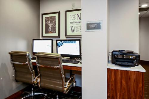 an office with a desk with three computers and a printer at Best Western Plus Bellingham in Bellingham
