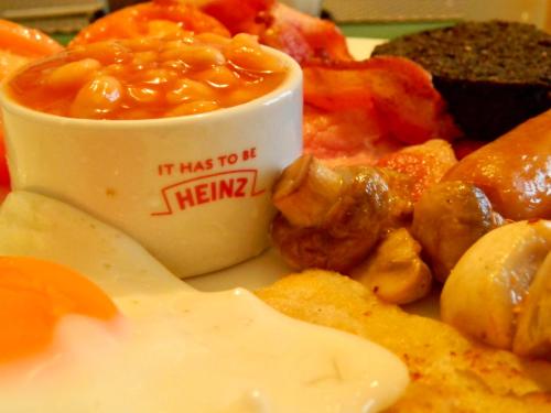a plate of food with a bowl of sauce at Wardicott in Back