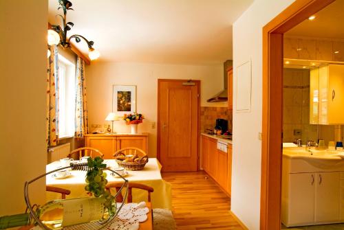 a kitchen with a sink and a counter top at Hotel Rauscher - Das Naturteichparadies in Bad Hofgastein