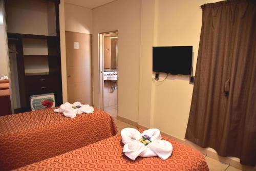 Postel nebo postele na pokoji v ubytování Hotel Confianza