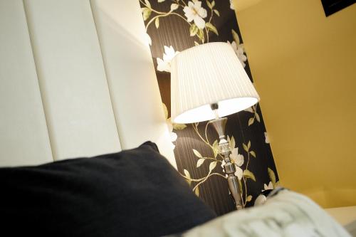 Ένα ή περισσότερα κρεβάτια σε δωμάτιο στο Cotford Hotel