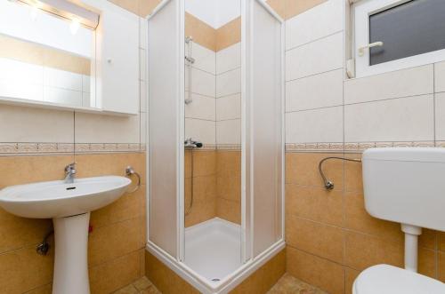 a bathroom with a shower and a sink at One-Bedroom Apartment Crikvenica near Sea 3 in Crikvenica