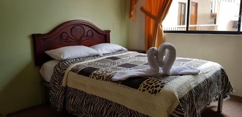 Uma cama ou camas num quarto em Hostal Pucará