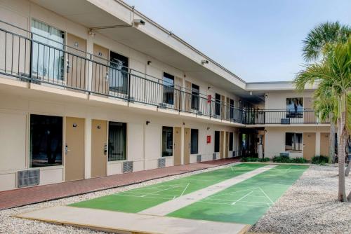 a building with a basketball court in the courtyard at Super 8 by Wyndham St. Petersburg in St Petersburg
