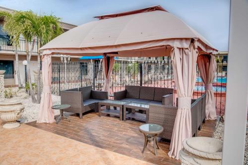 a large umbrella sitting on a patio at Super 8 by Wyndham St. Petersburg in St Petersburg
