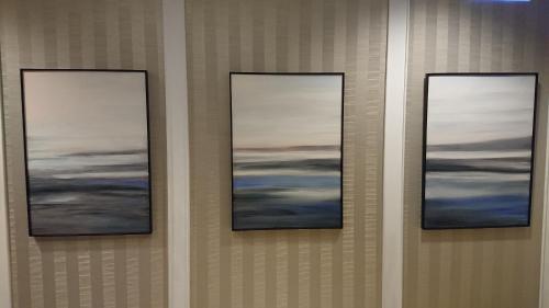 three framed pictures on a wall in a room at 高第商旅 Gaudi Hotel in Kaohsiung