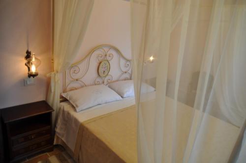 a bed with a white headboard in a bedroom at Apartment Umbertide 1 in Niccone