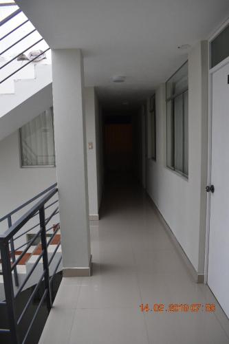 an empty hallway of a building with a staircase at Arum Qurpawasi Hospedaje in Cabanaconde