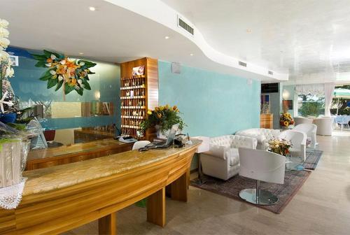 a large room with a lobby with a reception desk at Hotel Margareth in Riccione