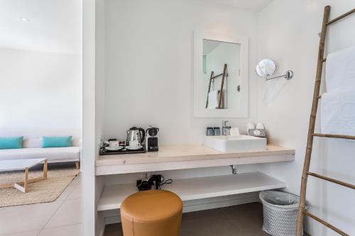 
a bathroom with a sink and a mirror at FERGUS Style Palmanova - Adults Only in Palmanova

