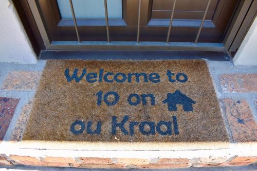 a welcome mat in front of a door at 10 On Ou Kraal in Edgemead