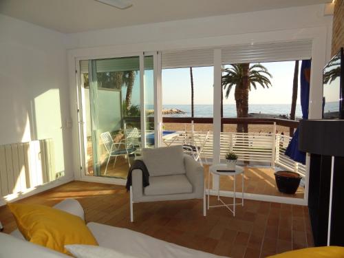 a living room with a view of the ocean at Penelope Apart in Sitges