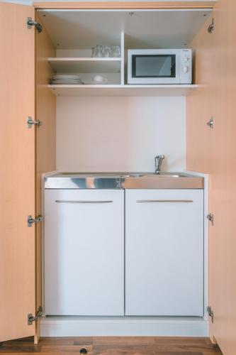 Hotel Sonne Garniにあるキッチンまたは簡易キッチン