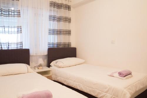 Ліжко або ліжка в номері Apartment Gianluca