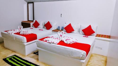 Postel nebo postele na pokoji v ubytování Roshanne Beach Resort