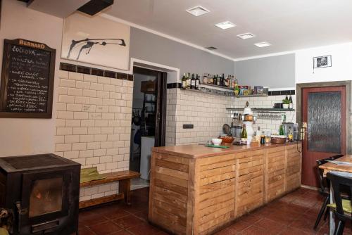 a kitchen with a counter in a restaurant at U Kosti - Bohemian Switzerland in Děčín