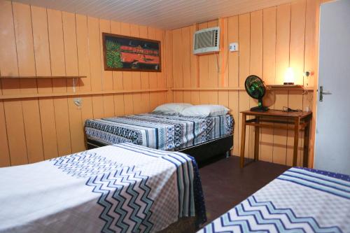 Posteľ alebo postele v izbe v ubytovaní Caboclos House Eco-Lodge