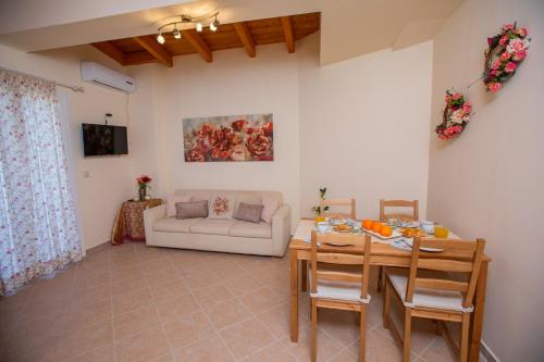 a living room with a table and a couch at Chrysianna seaview apartment in Argostoli