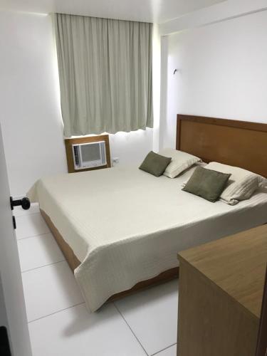 Cama ou camas em um quarto em Marupiara Suites Flats
