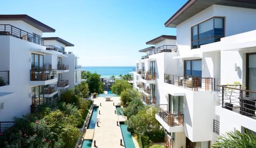 an apartment complex with a pathway between buildings at Discovery Boracay in Boracay