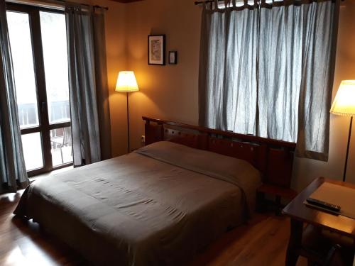 Katil atau katil-katil dalam bilik di Family Hotel Pchelina