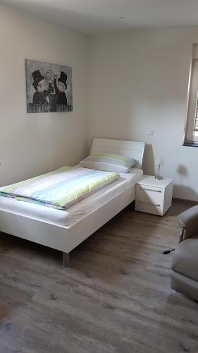 Postel nebo postele na pokoji v ubytování Boardinghouse Waldbronn