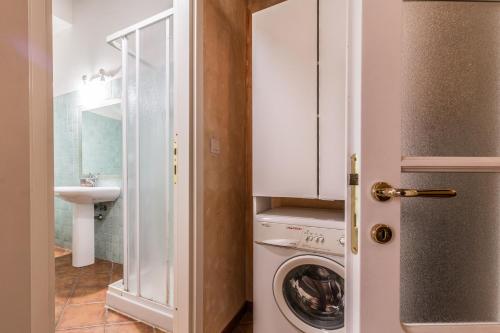 a laundry room with a washer and dryer at Design Apartments Sassari-Largo Cavallotti in Sassari