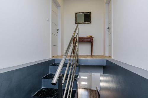 a staircase in a house with a blue floor at Superior apartment Nike in Mlini