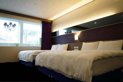 Llit o llits en una habitació de Yily House怡家居
