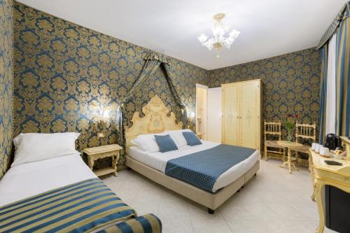 Ένα ή περισσότερα κρεβάτια σε δωμάτιο στο Hotel San Giorgio