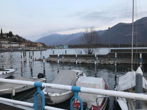 a group of boats docked at a dock in the water at Casa Marconi in Lovere