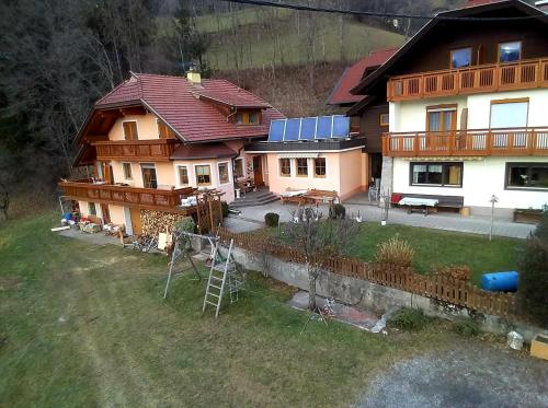 an aerial view of a house with a yard at Müllnerhaus in Millstatt