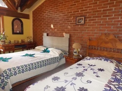 Ένα ή περισσότερα κρεβάτια σε δωμάτιο στο Casa Paanoramica