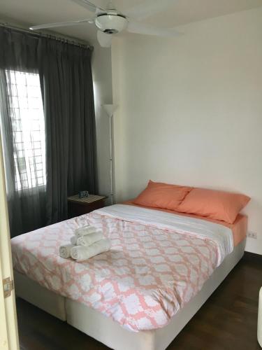 a bedroom with a bed with two towels on it at 266 @The Seacraze in Hua Hin