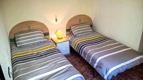 En eller flere senge i et værelse på La Casita Blanca - Vistabella Golf