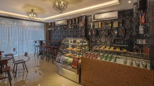 a bakery with a display case in a restaurant at V One Pride-Sukhumvit 22, Bangkok in Bangkok