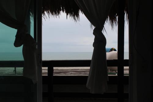 a view of the ocean from a resort window at Hotel Villas del Rey in Chachalacas