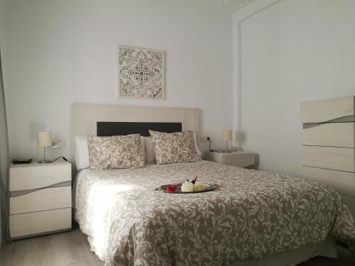Llit o llits en una habitació de Piso Con Terraza y Vistas Espectaculares