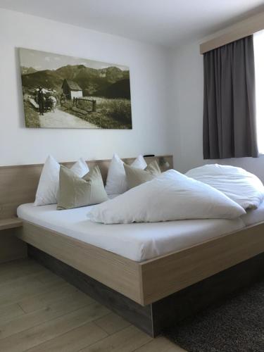 Posteľ alebo postele v izbe v ubytovaní Apart Alpinea