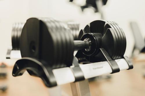 a row of dumbbells on a rack in a store at Residence Hotel in Vaduz