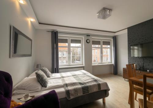 Posteľ alebo postele v izbe v ubytovaní Apartament SZEROKA