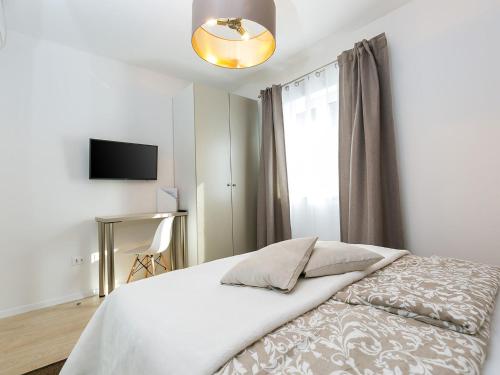 a bedroom with a white bed and a window at Holiday Dream in Vrsar